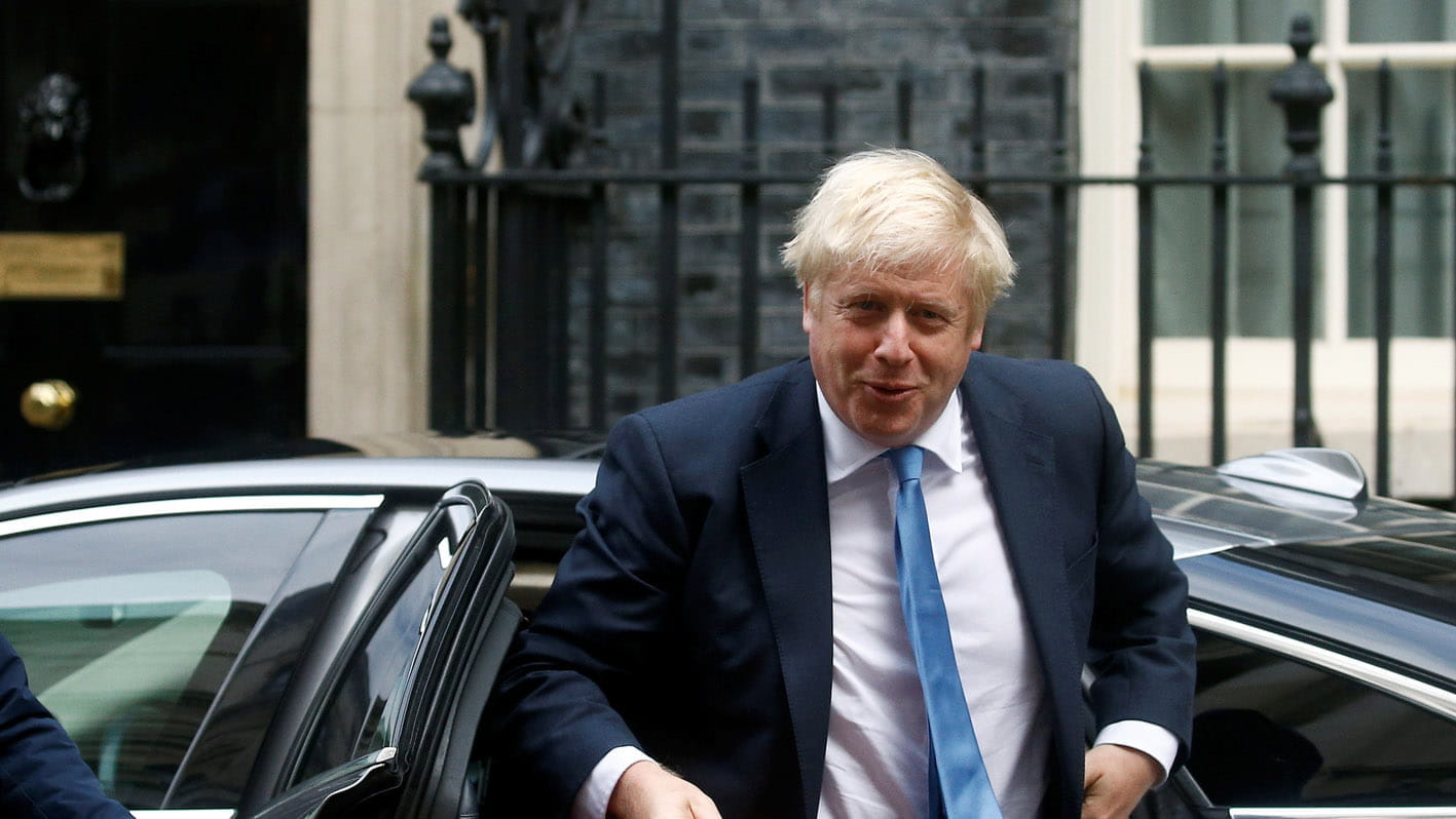 Picture of Boris Johnson exiting a car outside Number 10 with a red briefcase in hand