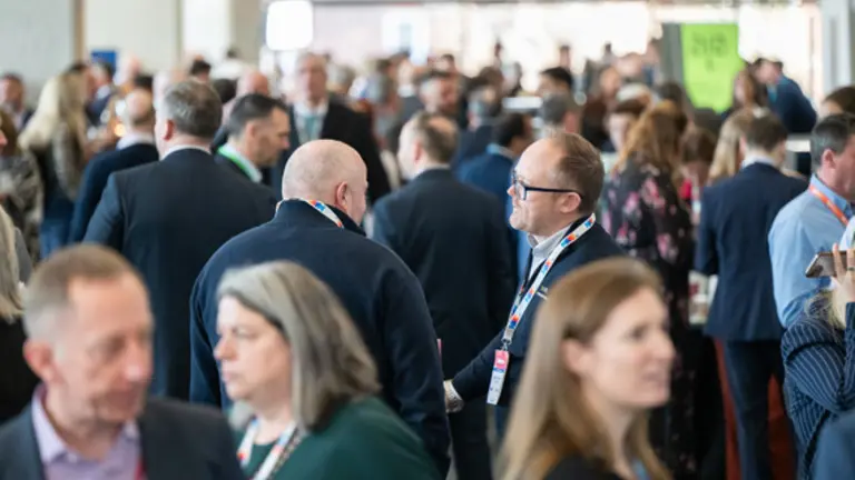 People networking at an exhibition event