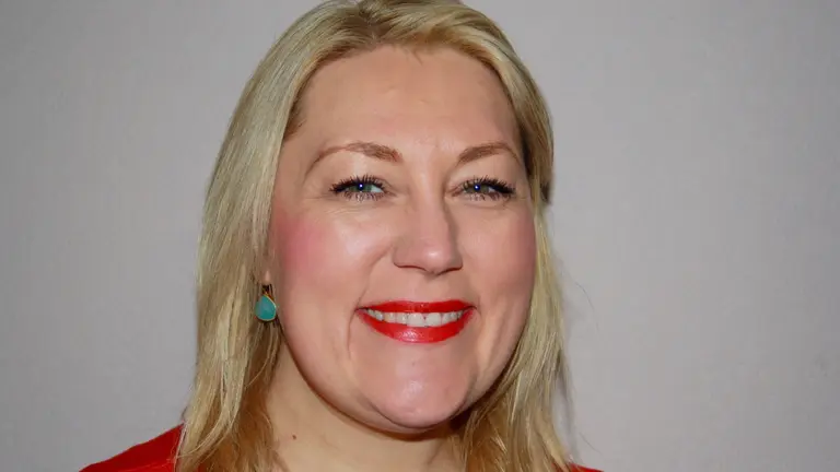 Woman smiling at camera.