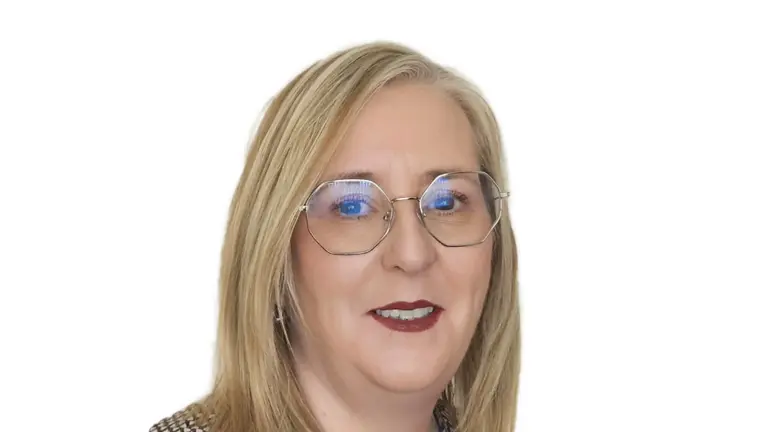 Blonde woman with glasses and red lipstick smiling