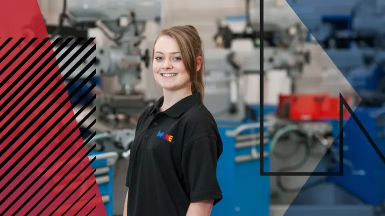 Image of woman wearing Make UK polo top in a factory setting. Make UK branded