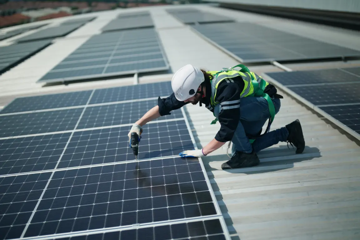 Man fitting solar panels