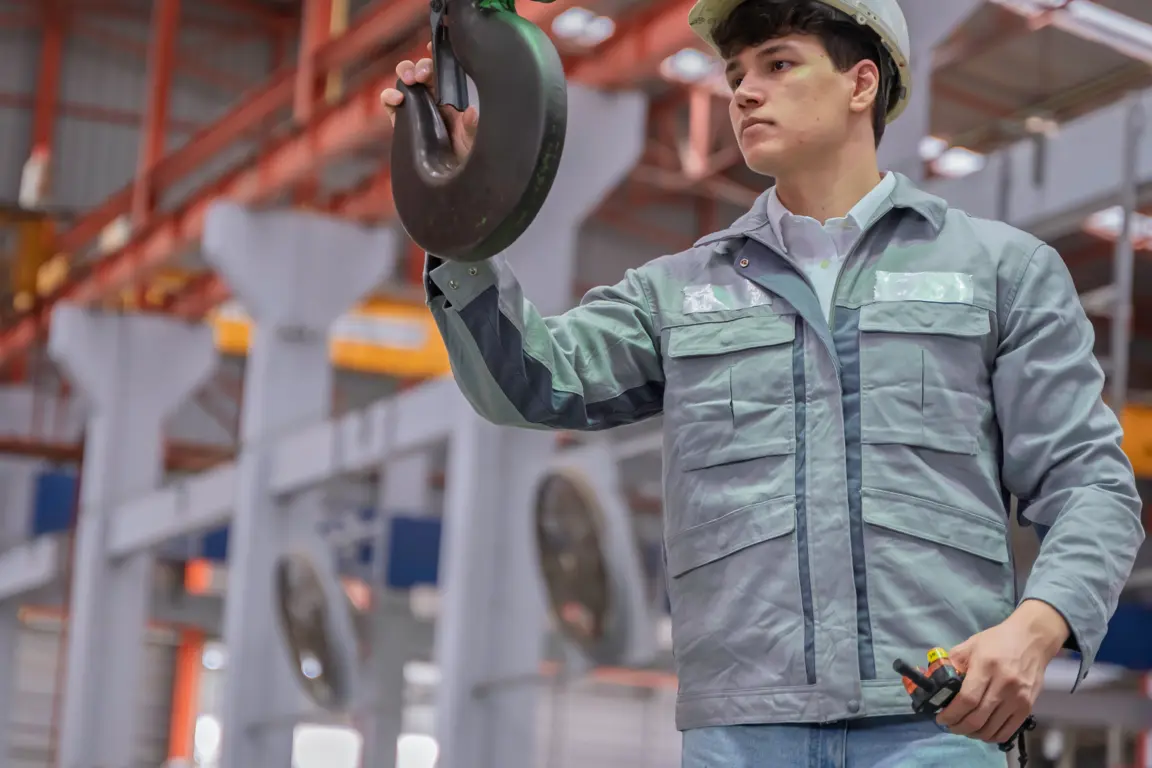 Manufacturer positioning hook from crane