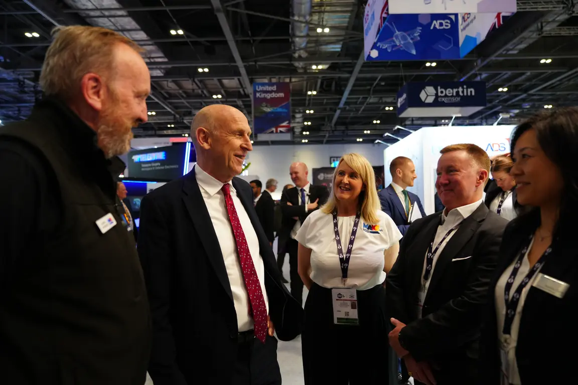 Image of people networking at Make Defence event