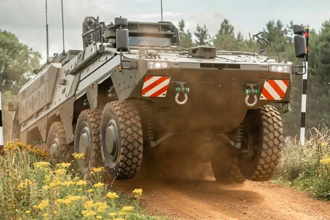A military vehicle or tank with red and white stripes on the side drives on a dirt path.