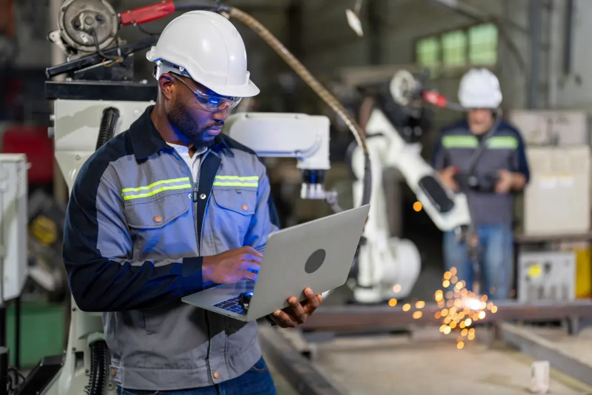 Worker using tablet in factory