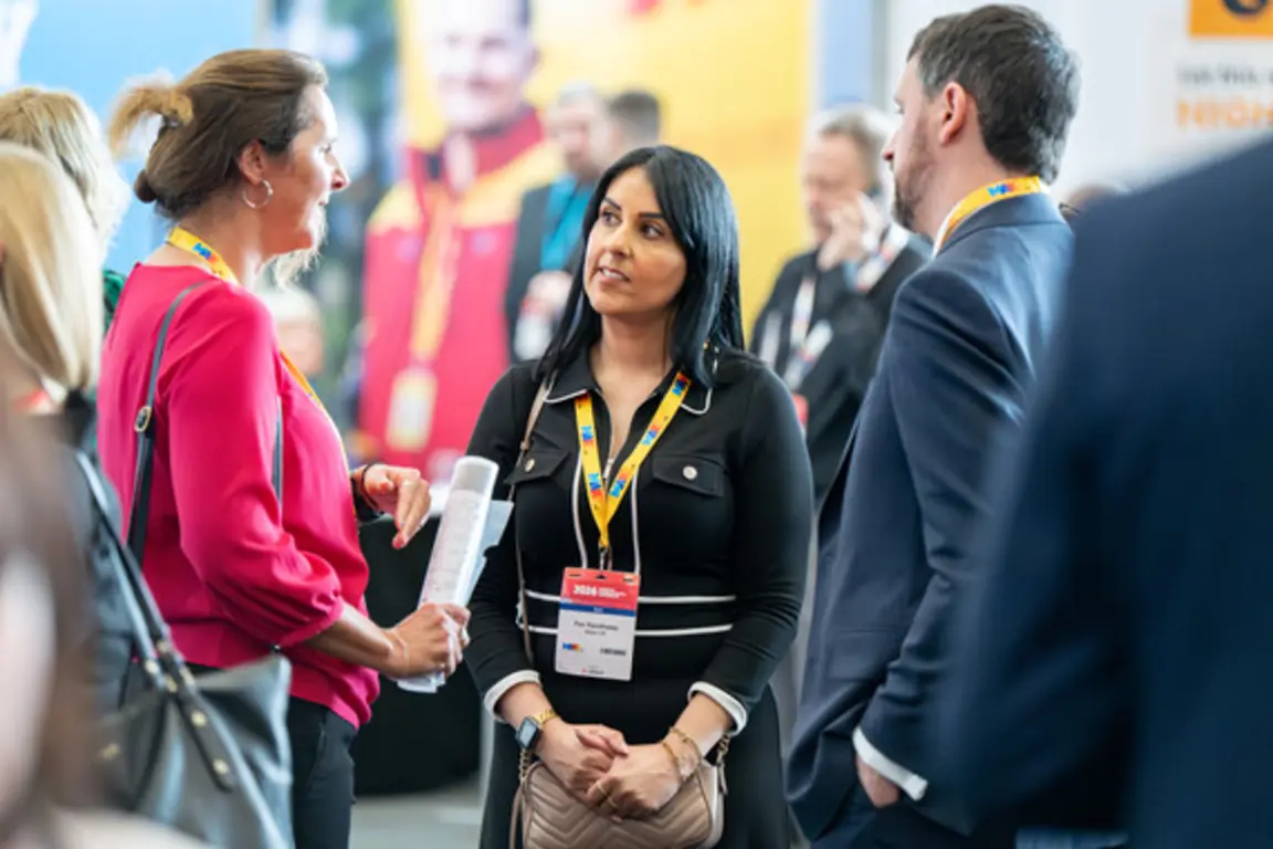 Three people networking at an event
