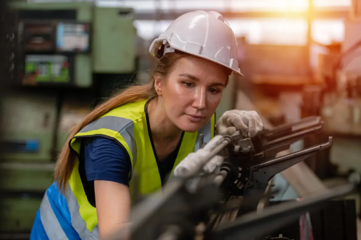 Female metalworker in factory