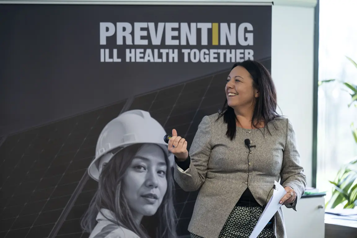 Jenny Rimmel speaking at an event