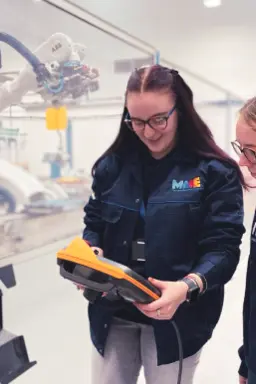 Two women in robotics lab