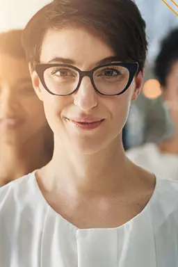 HR team standing looking into the camera confidently