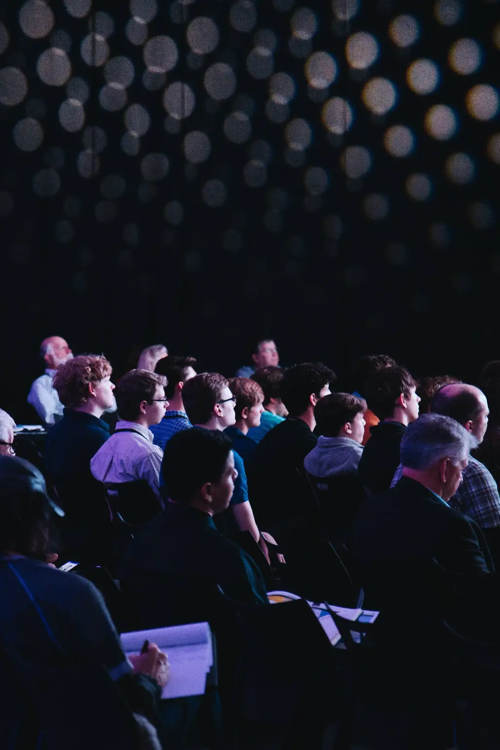 People seated at conference event 