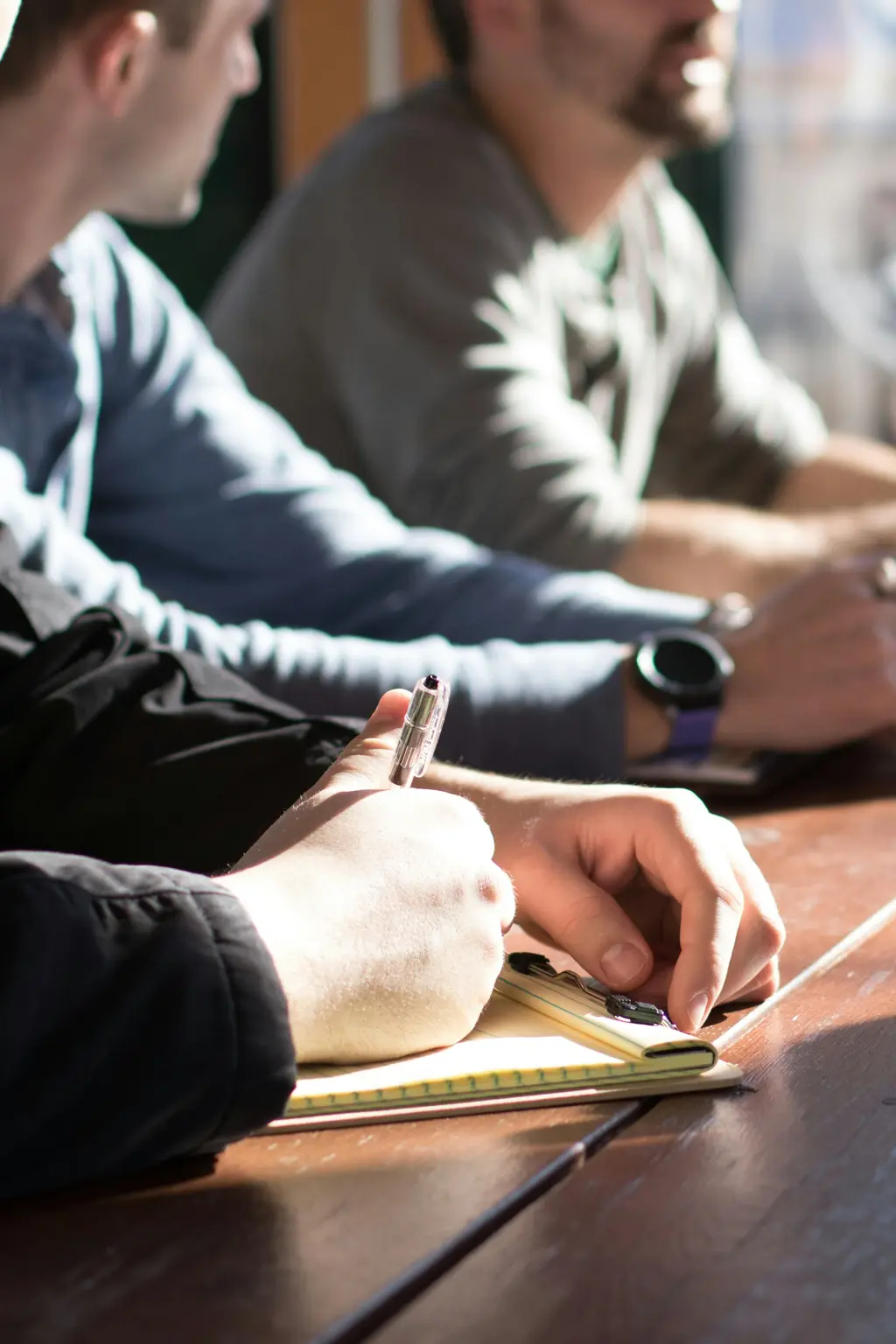 close up of people around table