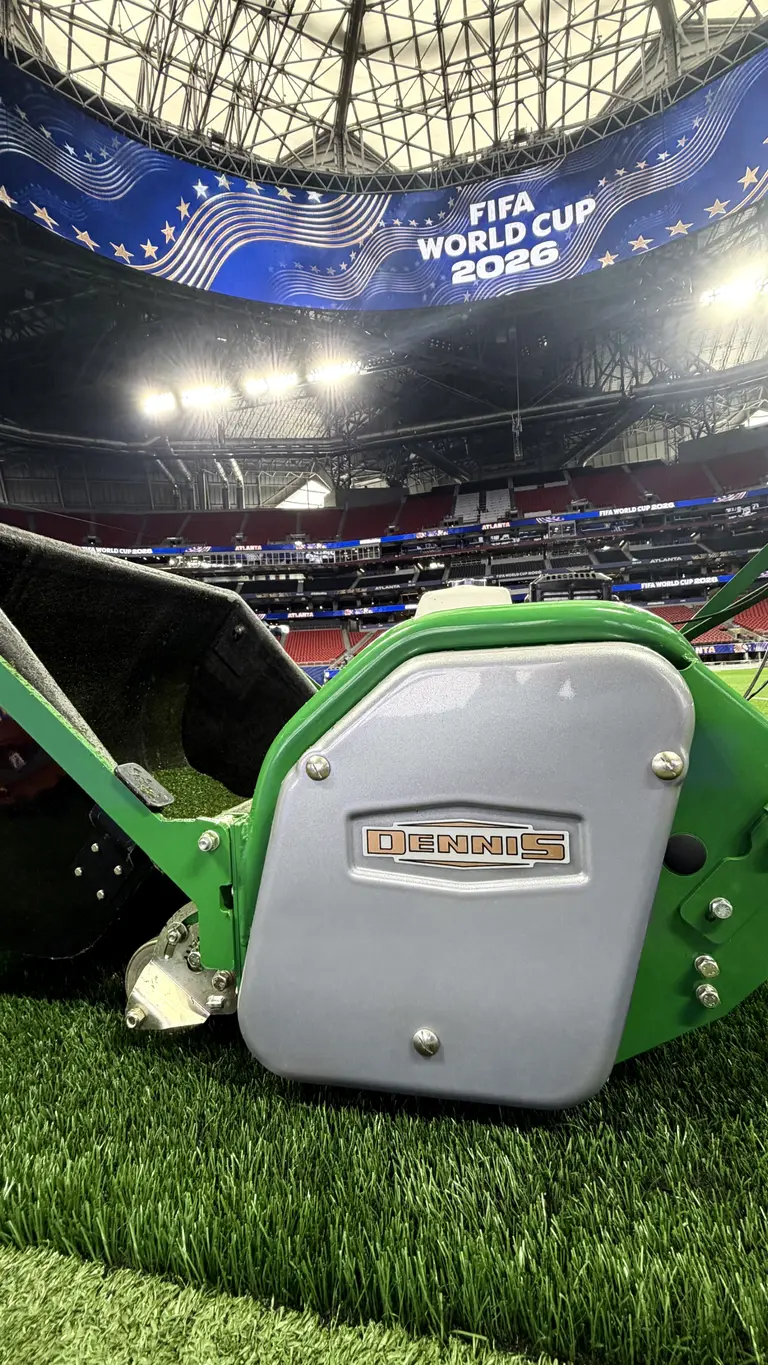 Dennis Lawn Mowers in Atlanta Stadium with 'FIFA World Cup 2026' on giant screen above
