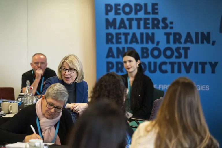 People seated at a Health & Safety conference