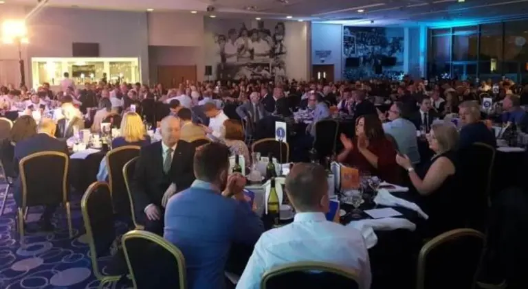 Wide shot of the room filled with tables and chairs