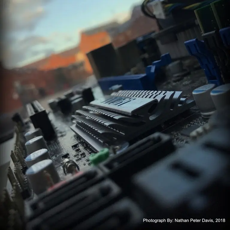 Close up of a motherboard with the sky in the background.