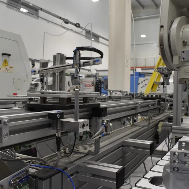 An industrial robot arm on a factory assembly line.